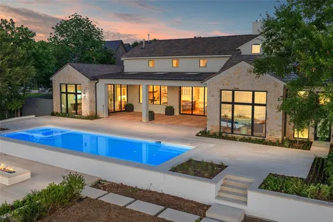 a view of swimming pool with an outdoor seating