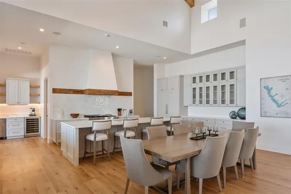 a view of a a dining room with furniture window and wooden floor