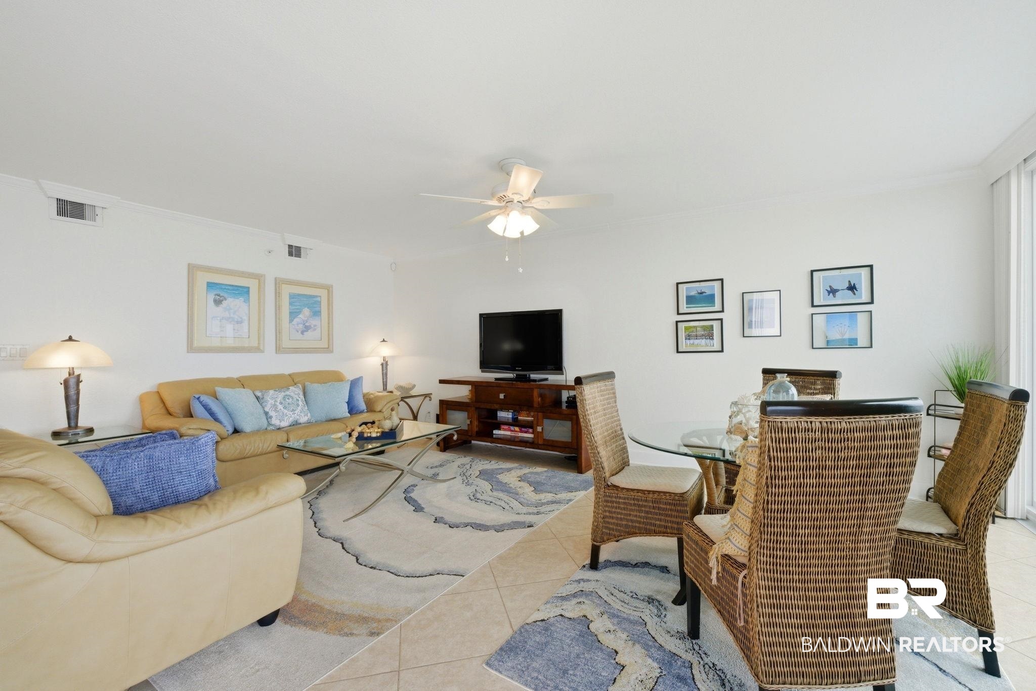 16284 Perdido Key Drive, Unit 912 Perdido Key, FL 32507 - Photo 13 of 49 Living room with ceiling fan and light tile patterned flooring