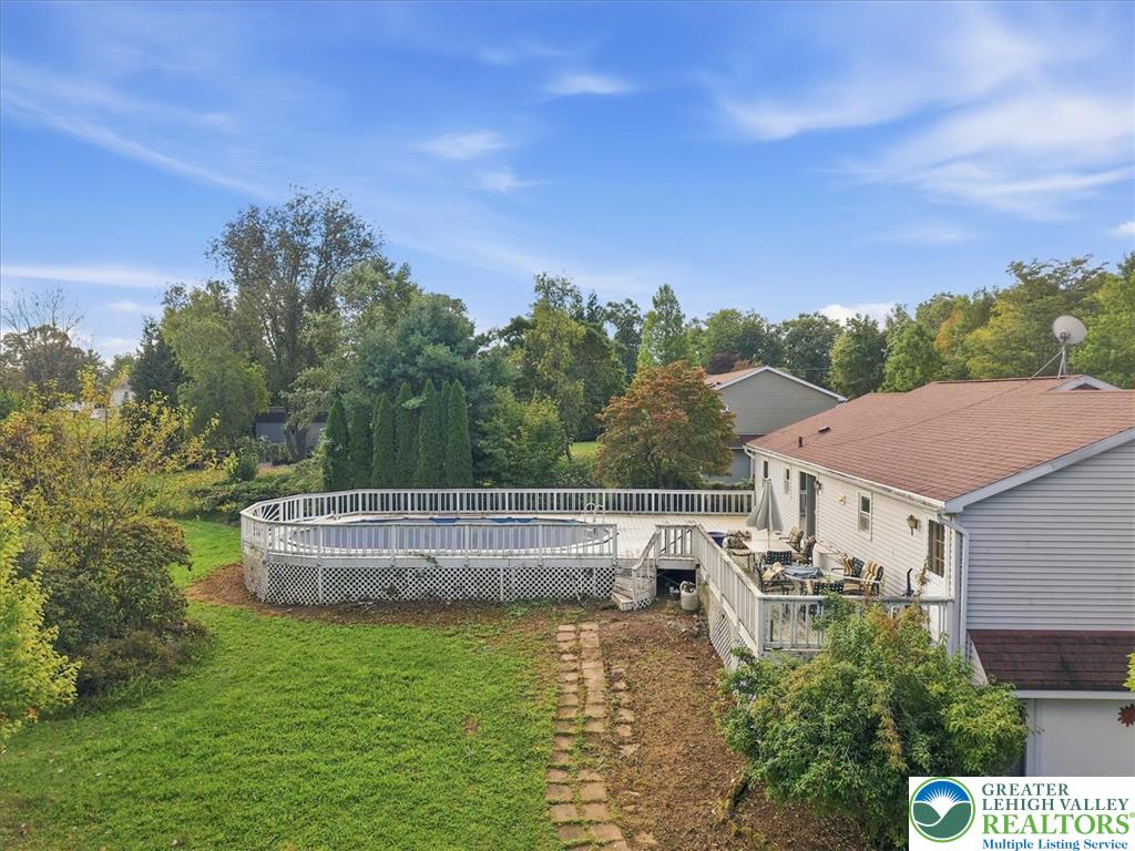 74 Swiss View Road Lehighton, PA 18235 - Photo 55 of 59 An elevated wood deck overlooks the spacious backyard and above-ground swimming pool.