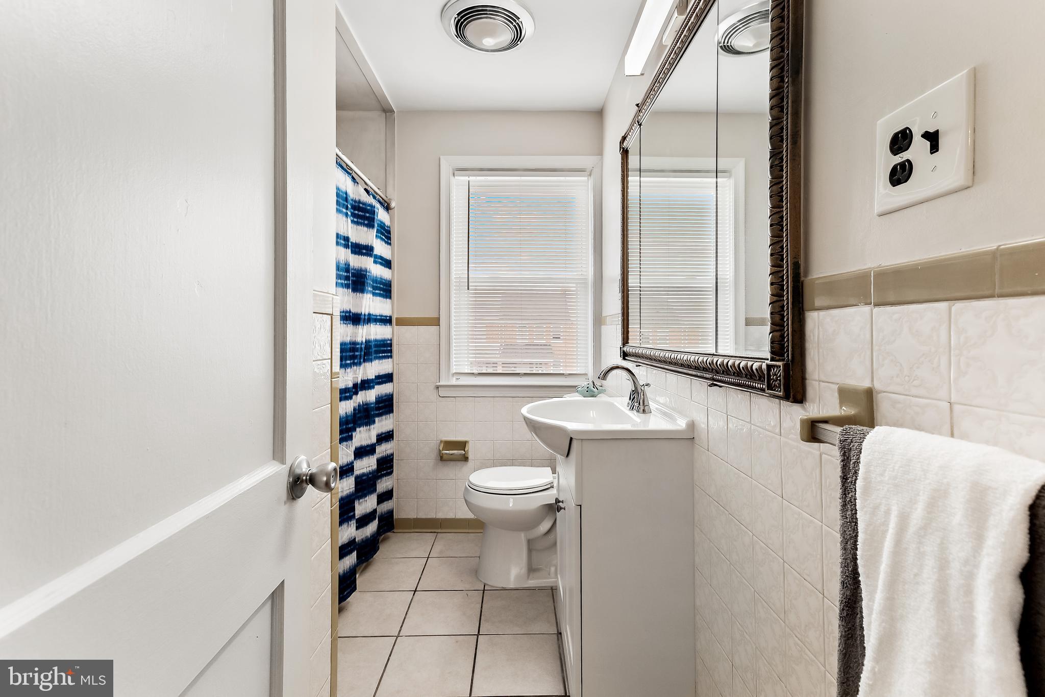 7259 Stratton Way Baltimore, MD 21224 - Photo 20 of 29 Retro bathroom has large linen closet