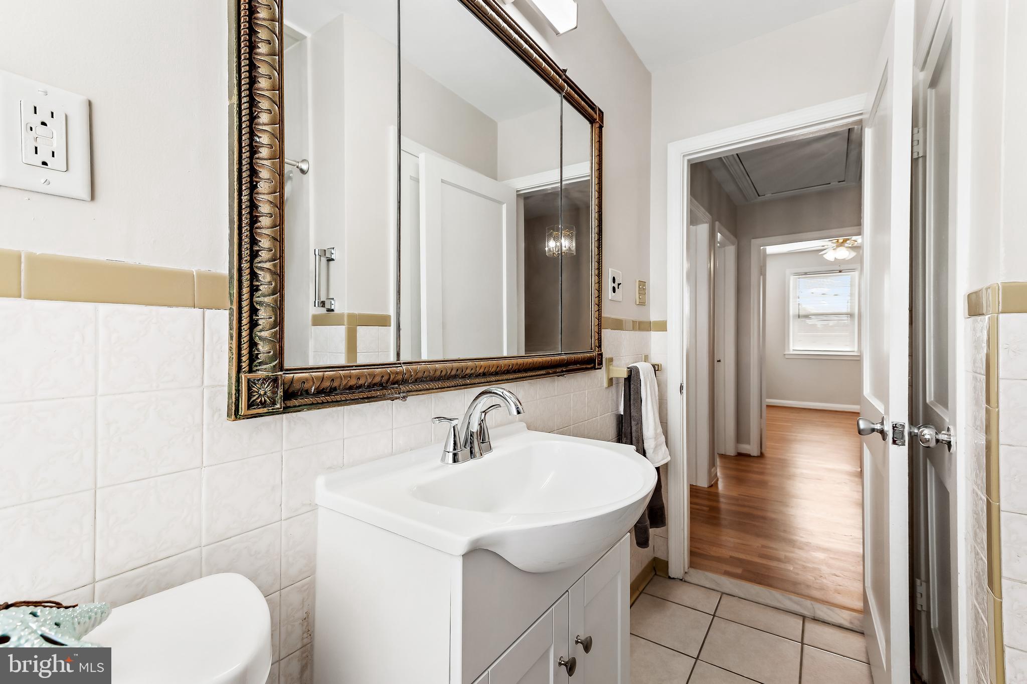 7259 Stratton Way Baltimore, MD 21224 - Photo 21 of 29 Large mirror with medicine cabinet storage