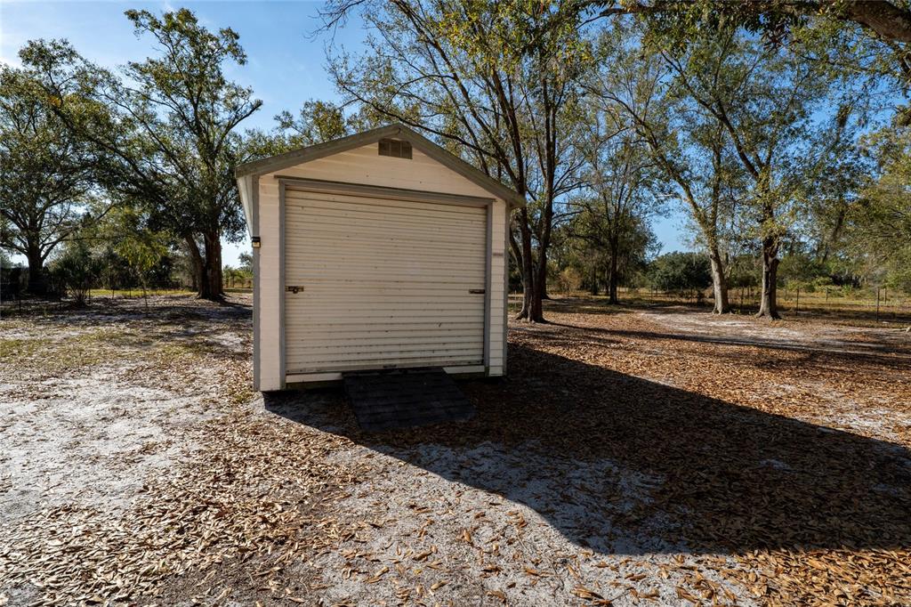 915 Keen Road, Unit 915 Frostproof, FL 33843 - Photo 13 of 53 a front view of a house with a yard