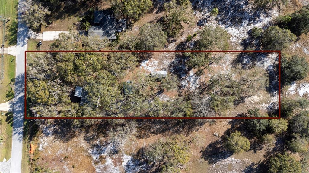 915 Keen Road, Unit 915 Frostproof, FL 33843 - Photo 20 of 53 a view of a yard with wooden fence