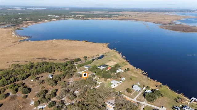 an aerial view of ocean with residential house and ocean view