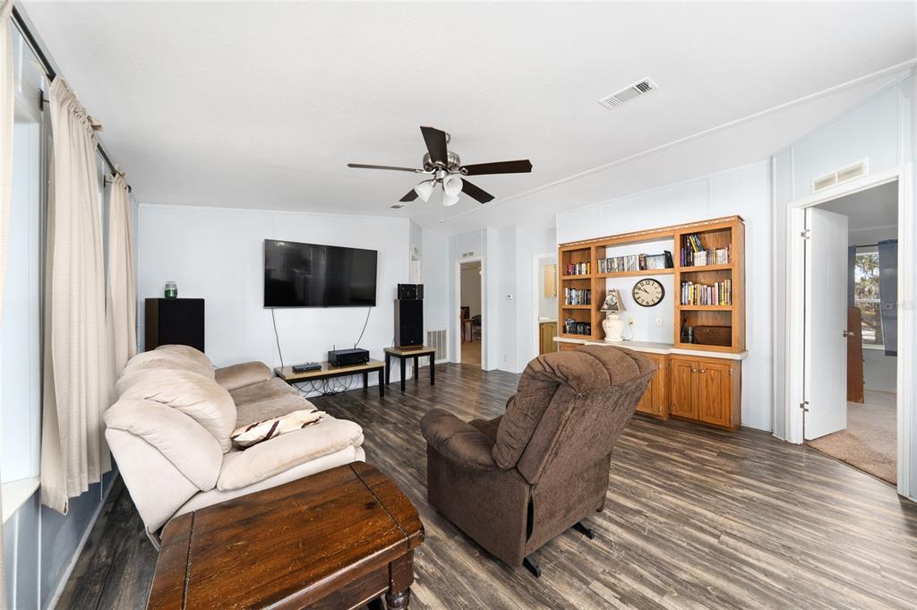 915 Keen Road, Unit 915 Frostproof, FL 33843 - Photo 35 of 53 a living room with furniture and a flat screen tv