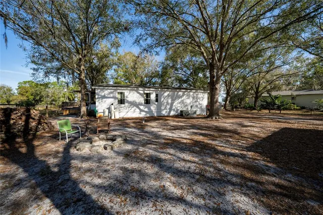 a view of backyard of a house