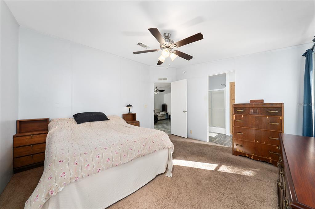 915 Keen Road, Unit 915 Frostproof, FL 33843 - Photo 45 of 53 a bedroom with a bed and a cabinets