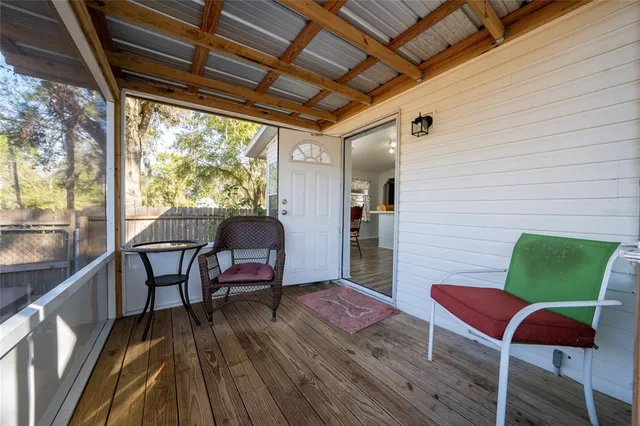 a balcony with furniture and a gate