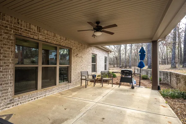 a view of a patio with table and chairs