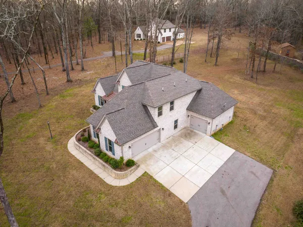 an aerial view of a house with garden space