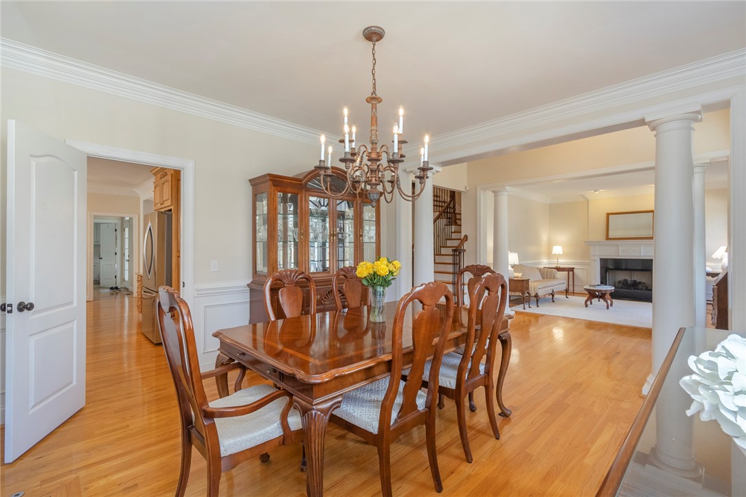 316 Avenue Of Oaks Anderson, SC 29621 - Photo 10 of 50 Elegant dining area featuring hardwood floors and an open concept leading to a comfortable living space.
