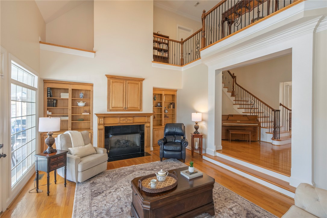 316 Avenue Of Oaks Anderson, SC 29621 - Photo 19 of 50 This airy living area features high ceilings, hardwood flooring, and a classic fireplace.
