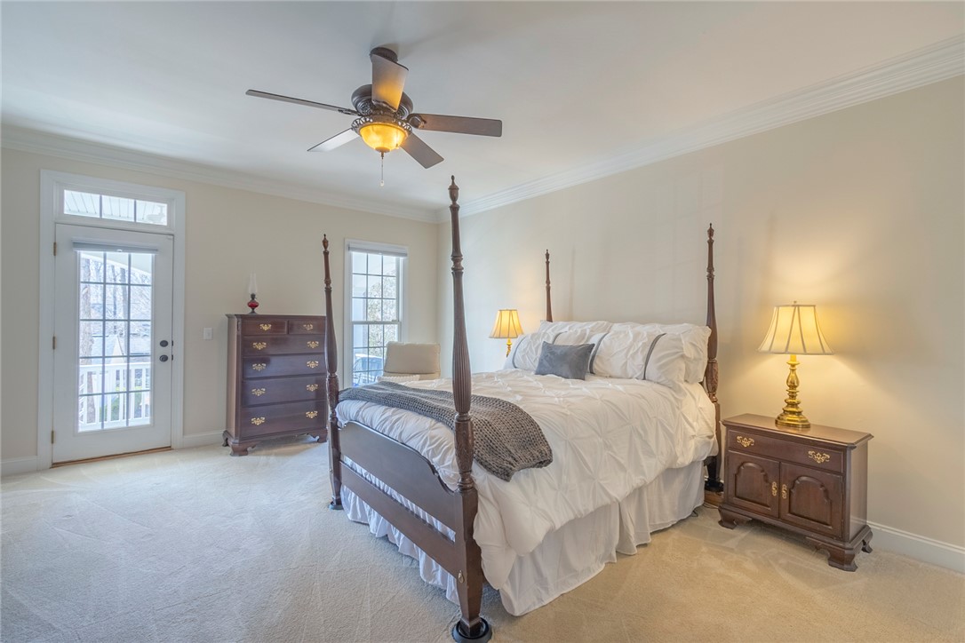 316 Avenue Of Oaks Anderson, SC 29621 - Photo 20 of 50 This spacious bedroom offers comfortable living with a private balcony and soft carpeting.
