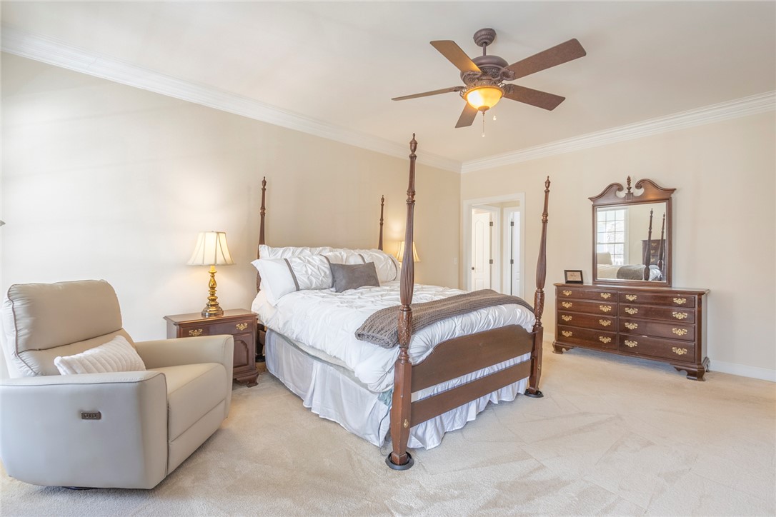 316 Avenue Of Oaks Anderson, SC 29621 - Photo 21 of 50 This tranquil primary bedroom features plush carpet and ample space for relaxation.