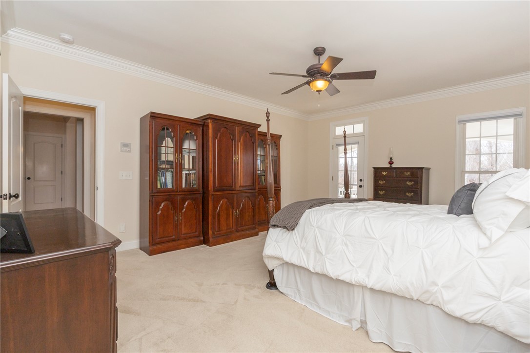 316 Avenue Of Oaks Anderson, SC 29621 - Photo 22 of 50 This spacious room features crown molding and carpeted floors, with ample natural light.