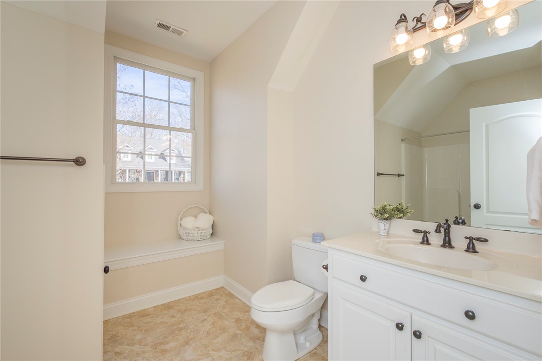 316 Avenue Of Oaks Anderson, SC 29621 - Photo 30 of 50 This bright bathroom features a spacious vanity and a large window, offering a serene start to your day.