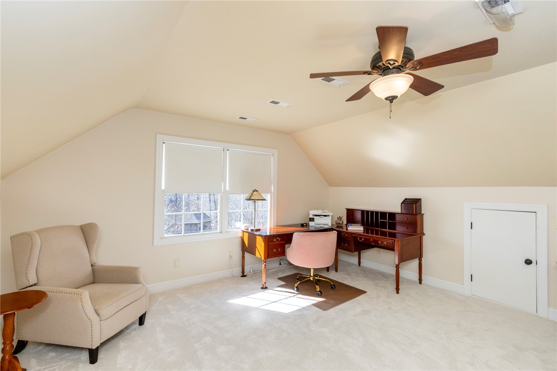 316 Avenue Of Oaks Anderson, SC 29621 - Photo 31 of 50 This spacious room features vaulted ceilings, ample natural light, and plush carpeting.