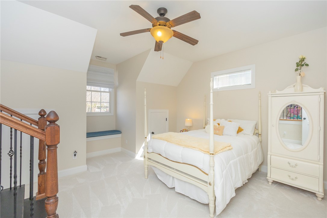 316 Avenue Of Oaks Anderson, SC 29621 - Photo 33 of 50 This cozy bedroom features sloped ceilings and ample natural light, creating a serene retreat.