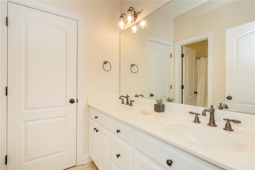 316 Avenue Of Oaks Anderson, SC 29621 - Photo 36 of 50 This bright bathroom features a spacious vanity with dual sinks, offering both style and functionality.