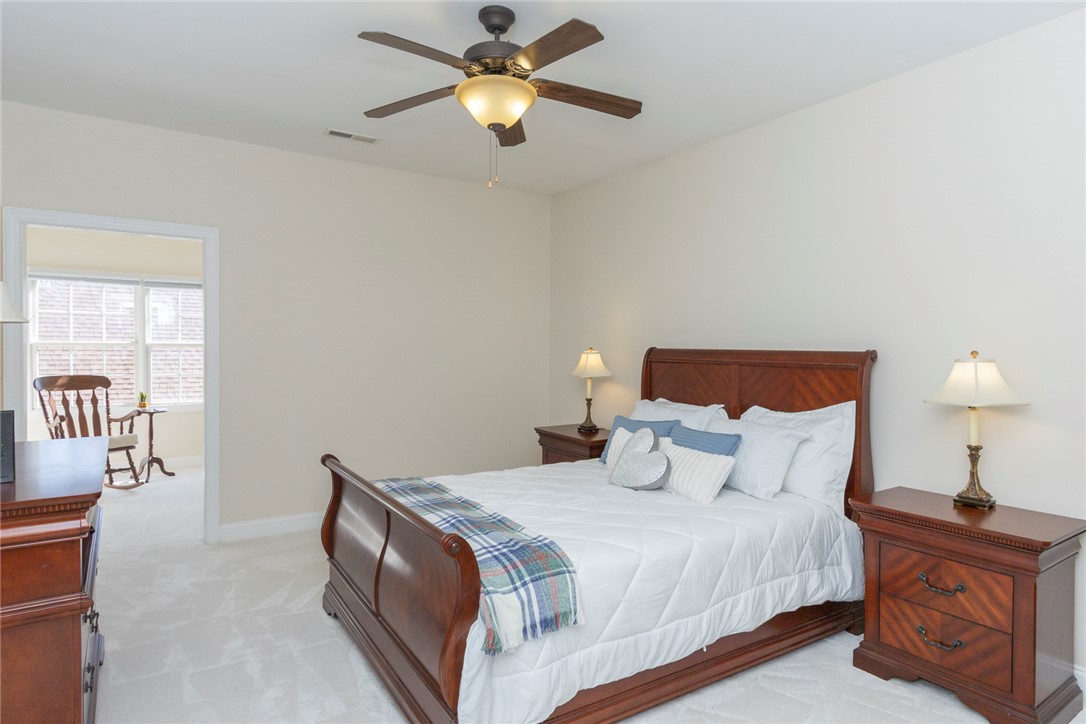 316 Avenue Of Oaks Anderson, SC 29621 - Photo 37 of 50 This inviting bedroom features a classic wooden bed frame, offering comfort and style for restful nights.