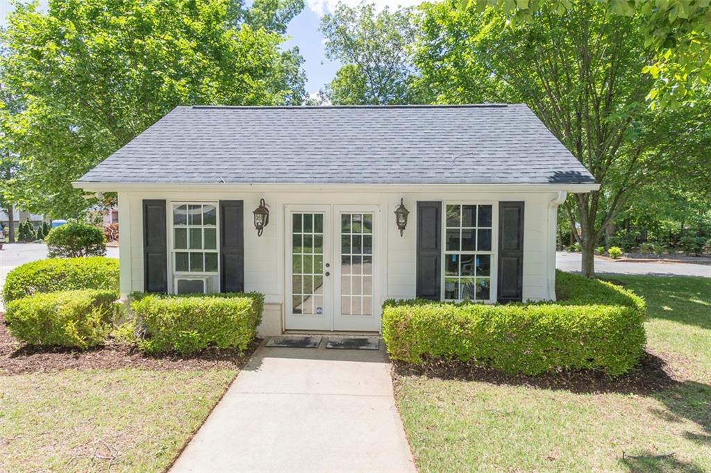 316 Avenue Of Oaks Anderson, SC 29621 - Photo 45 of 50 This charming cottage-style exterior features a well-maintained garden and inviting entryway.