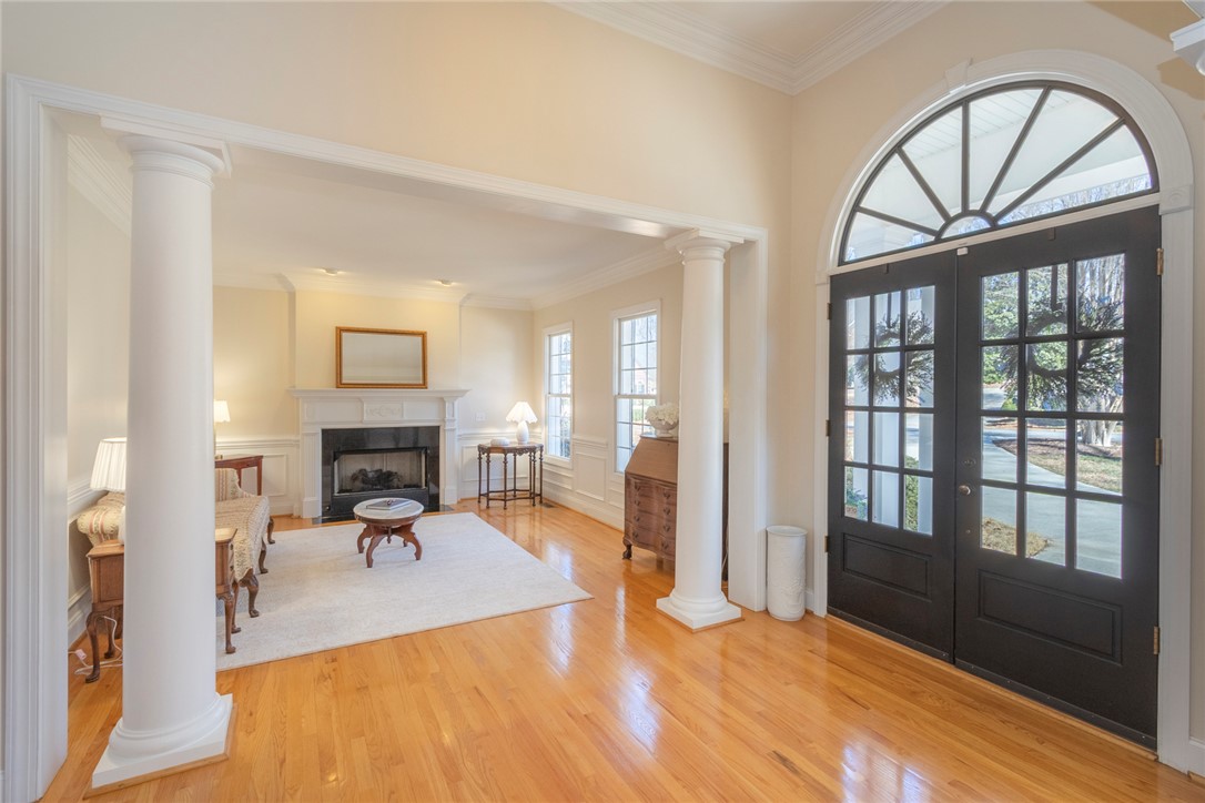 316 Avenue Of Oaks Anderson, SC 29621 - Photo 5 of 50 This bright entrance welcomes you with a grand arched doorway and gleaming hardwood floors.