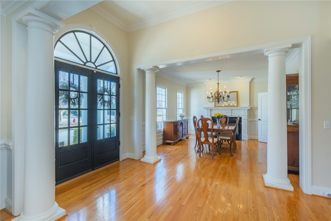 316 Avenue Of Oaks Anderson, SC 29621 - Photo 6 of 50 Enter into a home with polished hardwood floors and classic architectural columns framing the dining area.