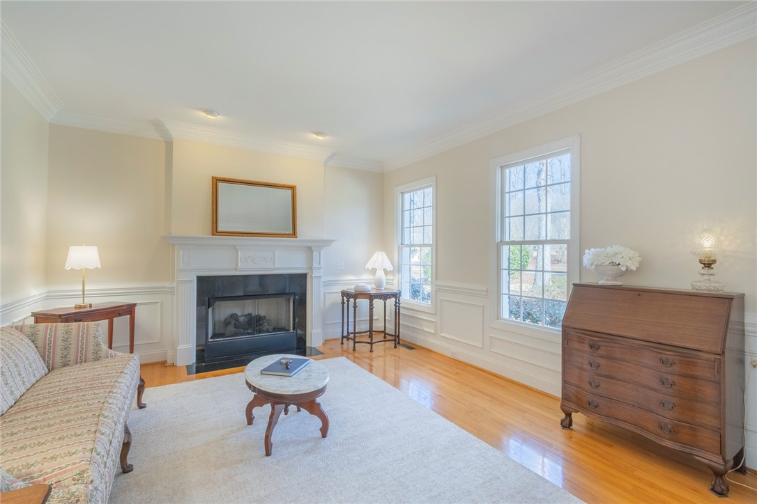 316 Avenue Of Oaks Anderson, SC 29621 - Photo 7 of 50 This living area features a classic fireplace, hardwood floors, and ample natural light.