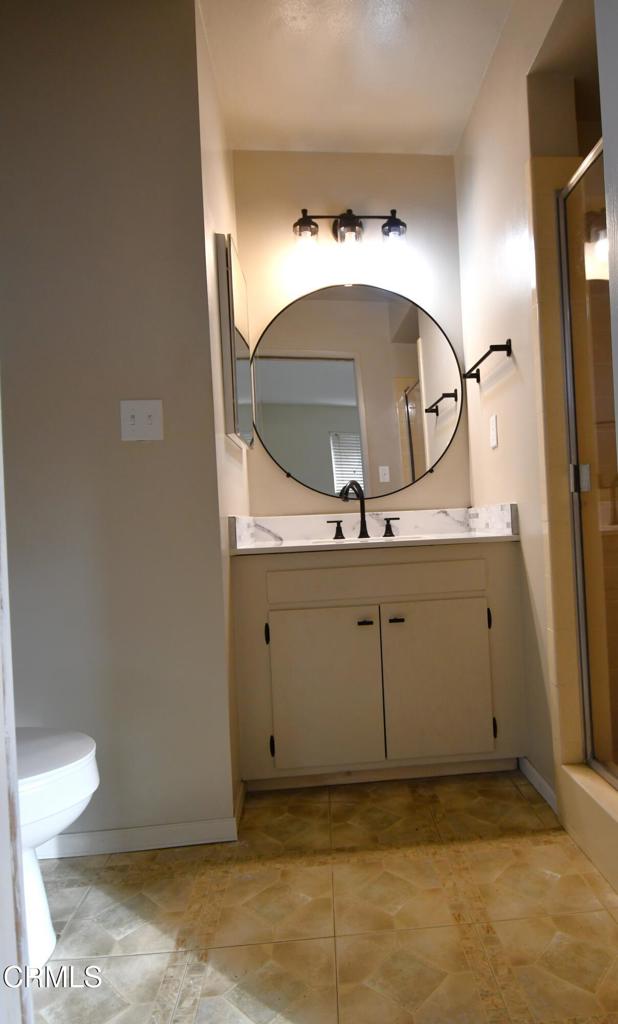 1731 Bernadette Street Oxnard, CA 93036 - Photo 18 of 30 a bathroom with a sink and a mirror