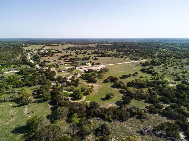 an aerial view of residential building and lake