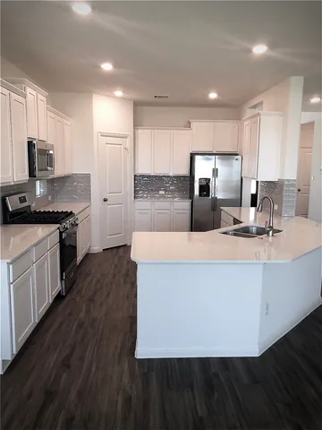 a bathroom with a glass shower door and a mirror