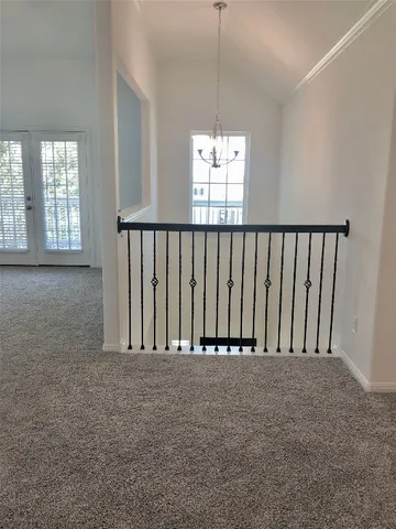 a large kitchen with kitchen island a sink dishwasher stove with wooden floor and cabinets