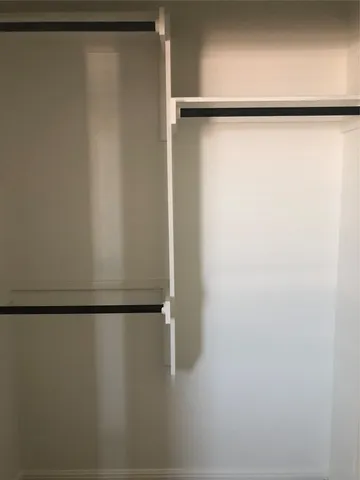 a view of balcony with wooden floor