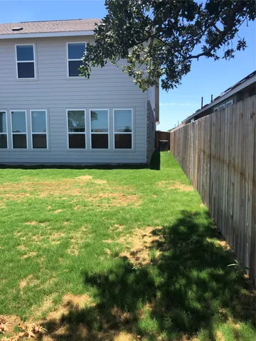 a view of a backyard with garden