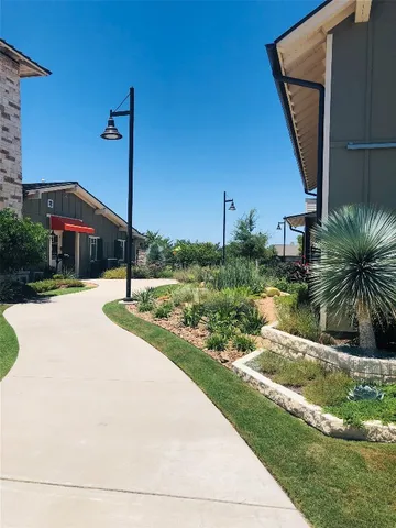 a front view of a building with garden