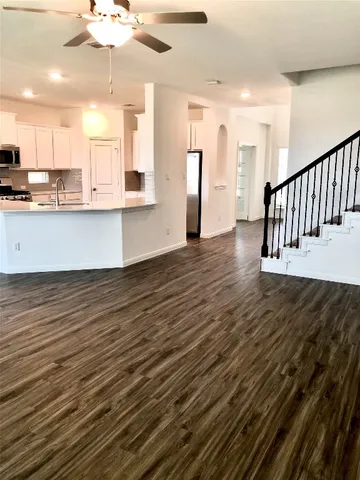 a view of a lake with houses in the background