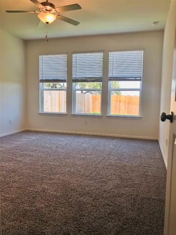 a view of kitchen with granite countertop cabinets and wooden floor