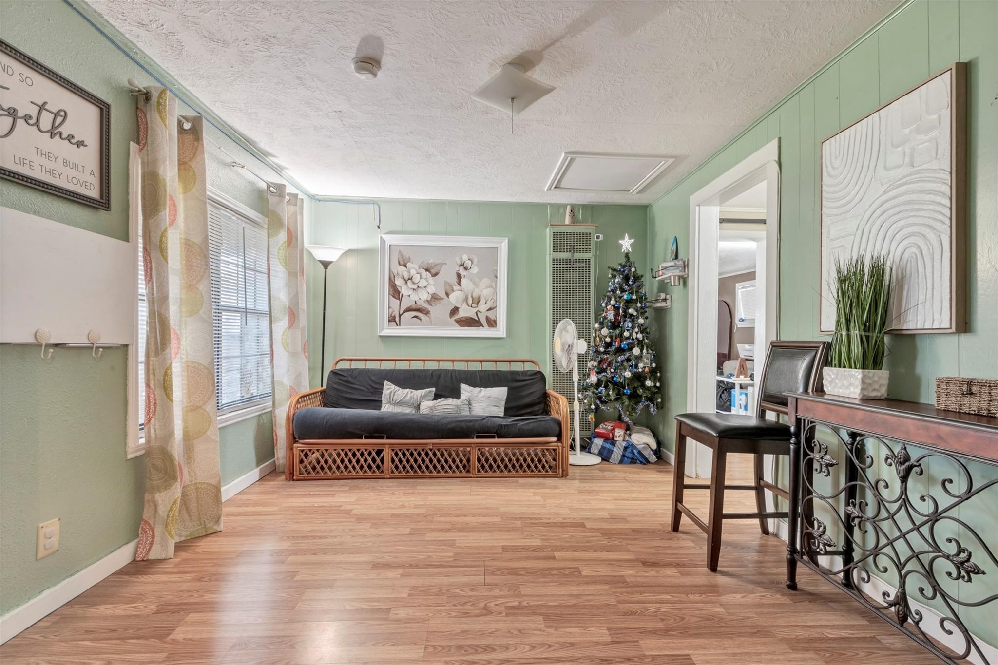 808 Morrell Street Baytown, TX 77520 - Photo 8 of 25 a living room with furniture and a painting on the wall