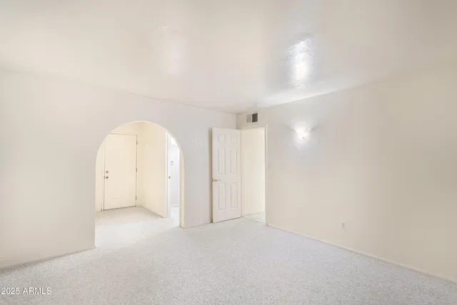 a bathroom with a shower and a toilet