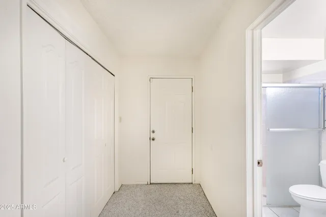 a bathroom with a sink a toilet a vanity and mirror