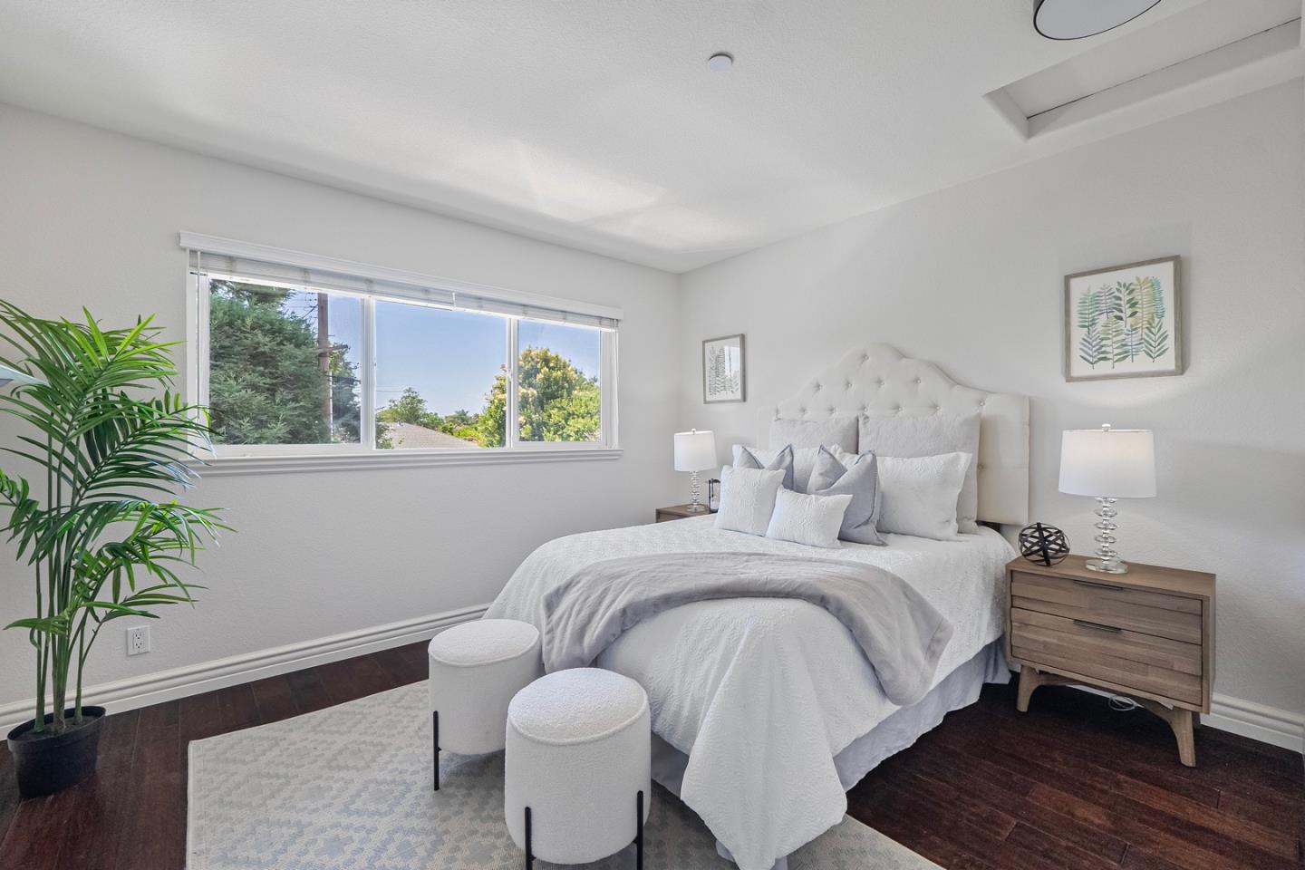 2580 Homestead Road, Unit 5201 Santa Clara, CA 95051 - Photo 18 of 38 a bedroom with a large bed and a potted plant