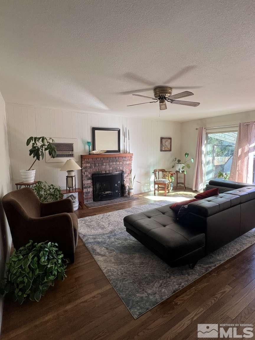 3080 Accacia Way Reno, NV 89503 - Photo 8 of 40 a living room with furniture fireplace and a window