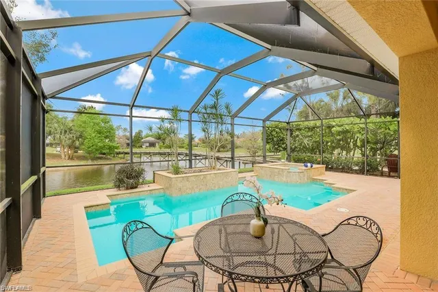 a view of a indoor swimming pool with a patio