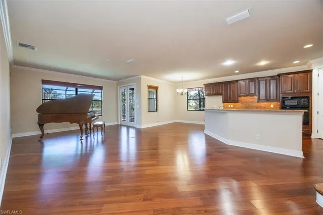 a view of kitchen with wooden floor and outdoor seating