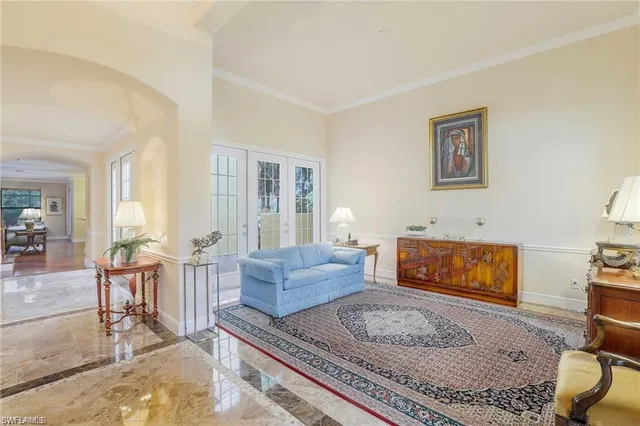 a living room with furniture and a rug