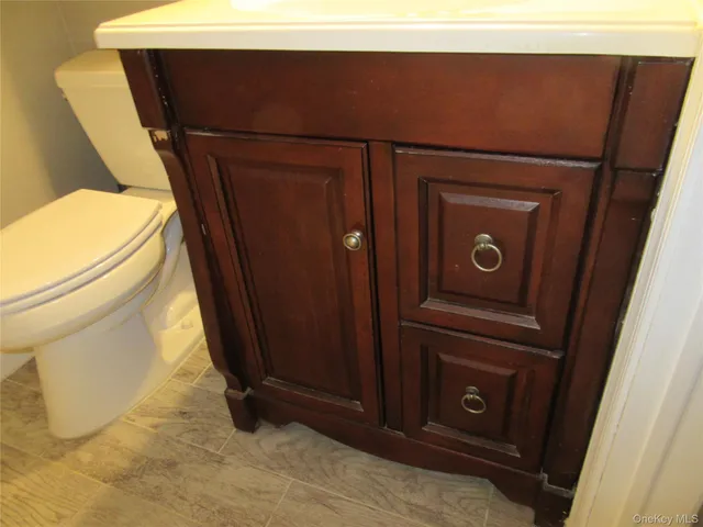 a bathroom with a toilet and a sink