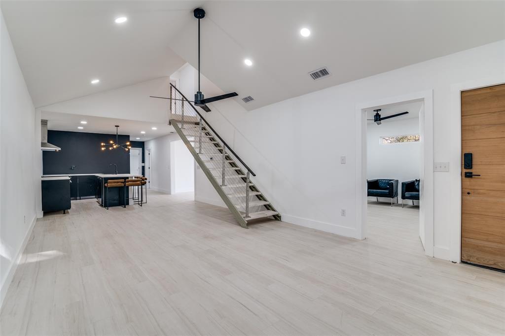 250 Skyview Point, TX 75472 - Photo 8 of 34 an empty room with wooden floor and windows