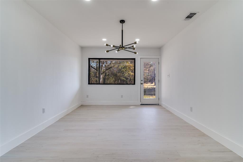 250 Skyview Point, TX 75472 - Photo 9 of 34 a view of an empty room with glass door