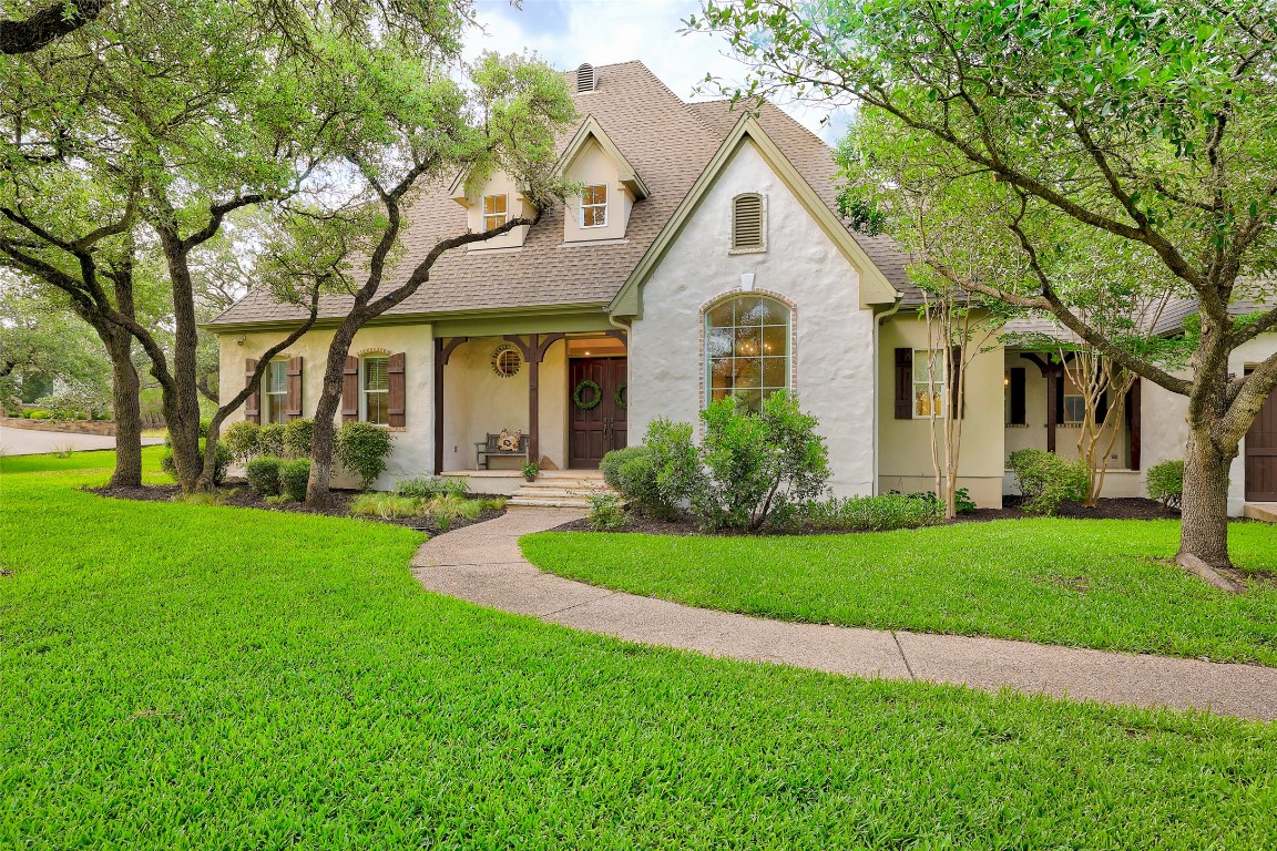 a front view of house with yard and green space